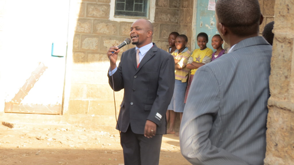 John Ngatia preaching in the open air meeting