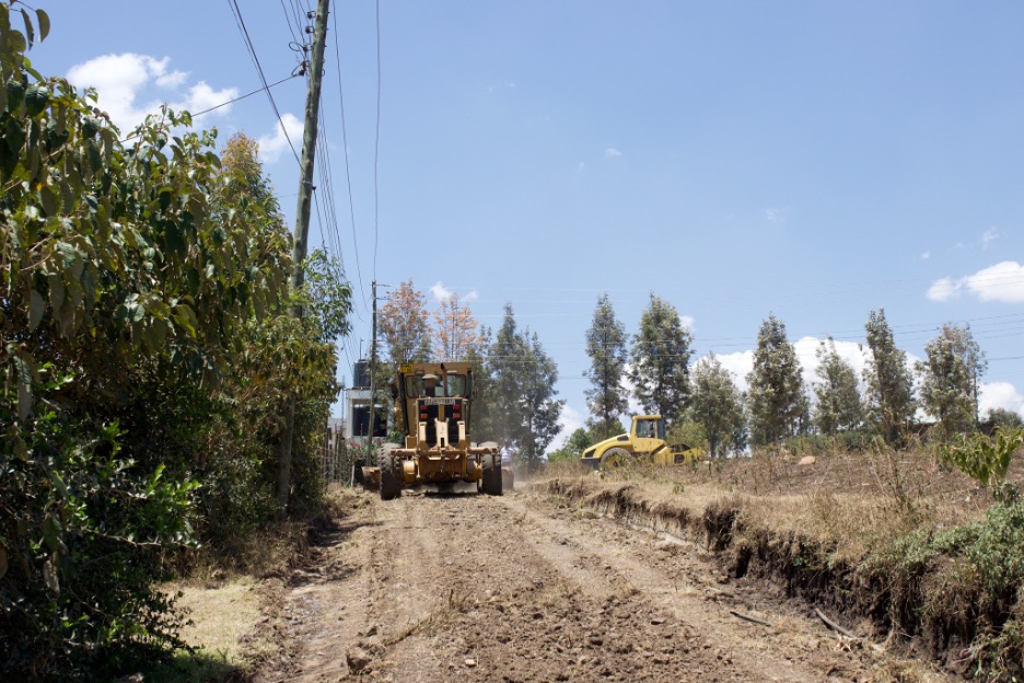 Grader working on road