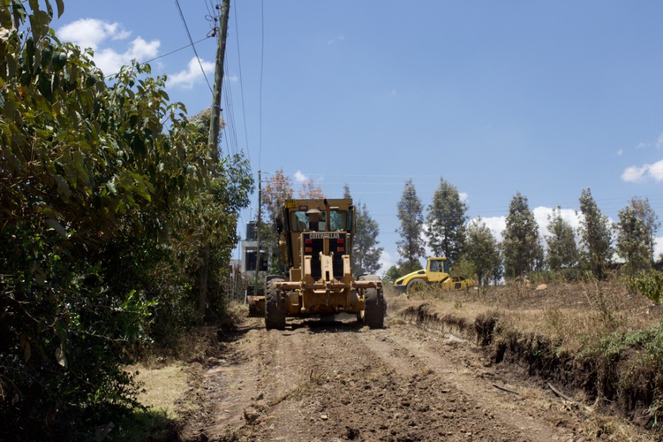 Grader working on road