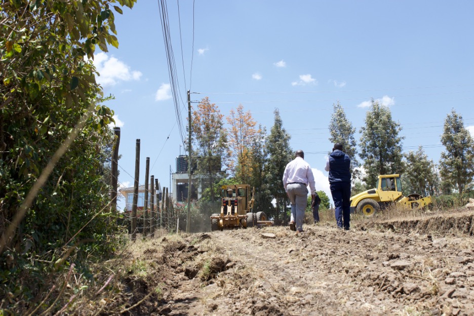 Paul talking with contractor working on road